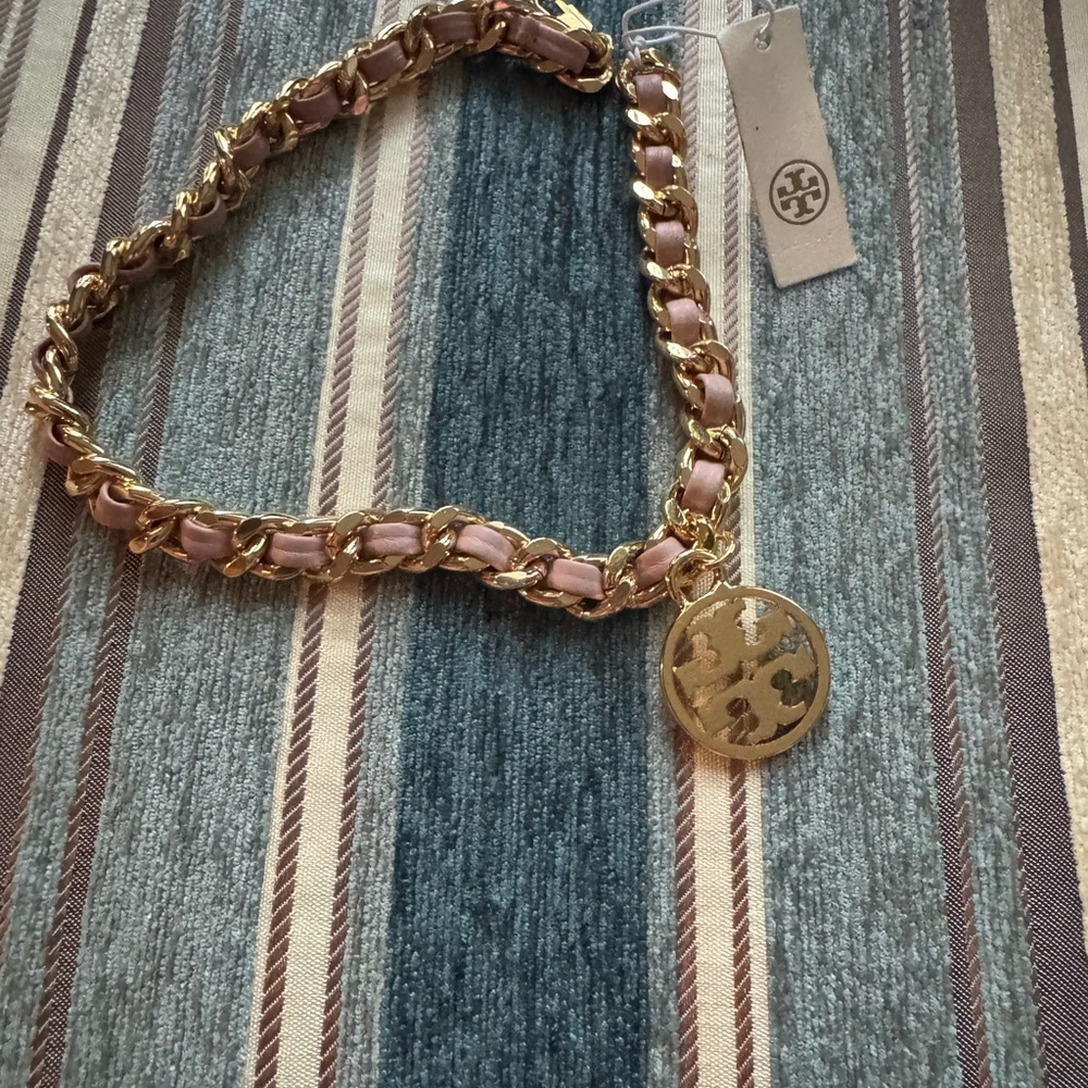 Tory Burch gold chain with pink wrap around bracelet